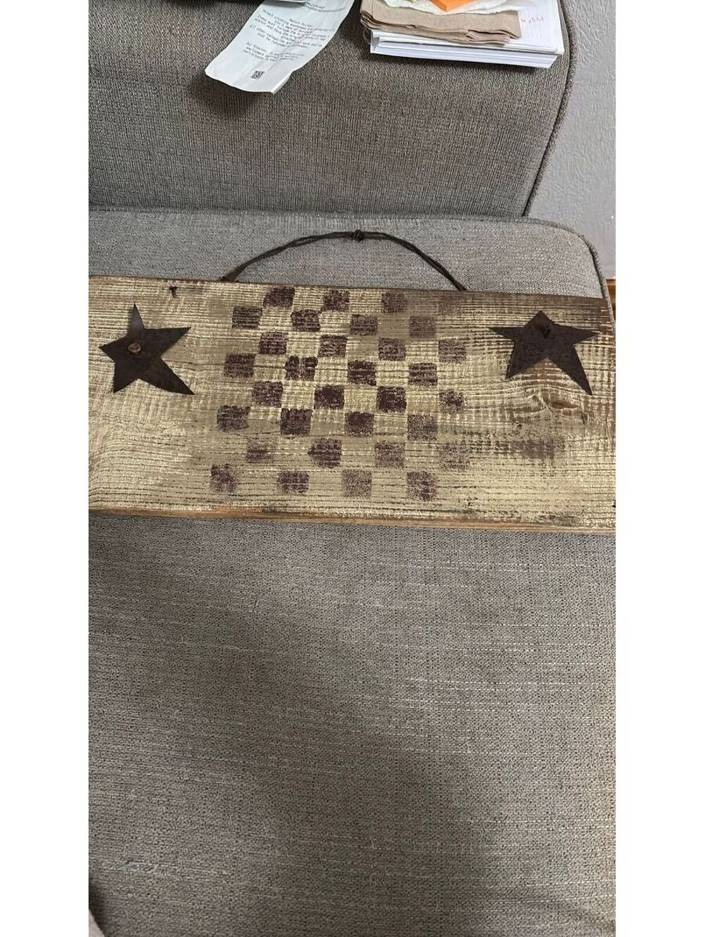 Primitive wall hanging with barb wire hanger